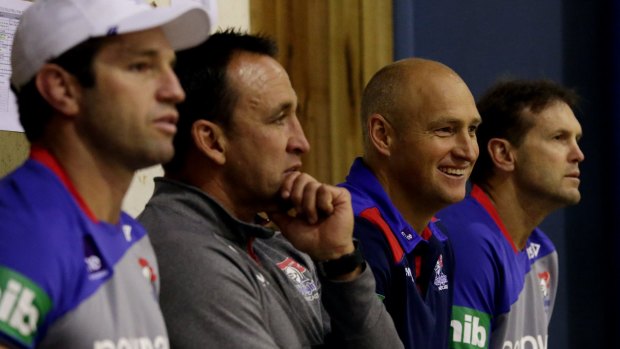 Moved on: Newcastle assistant coach Mick Potter, far right, will coach against his former Wests Tigers club for the first time this weekend.