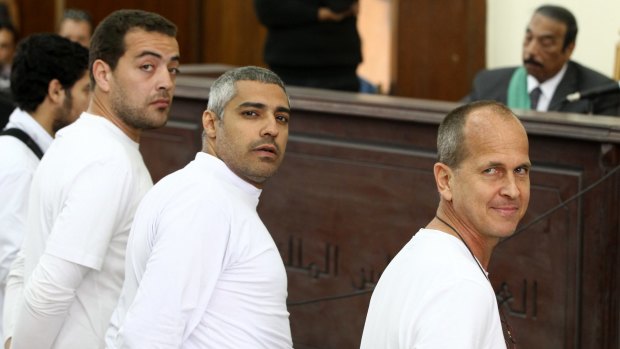 Al-Jazeera producer Baher Mohamed, left, Canadian-Egyptian bureau chief Mohammed Fahmy, centre, and Peter Greste in March 2014. 