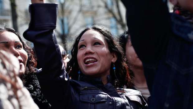 A sex worker shouts slogans during a protest against a new law that targets the clients of prostitutes.