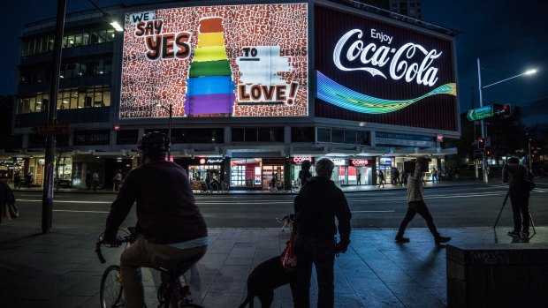 The Coca-Cola sign in Kings Cross has been changed to show support for same-sex marriage. 