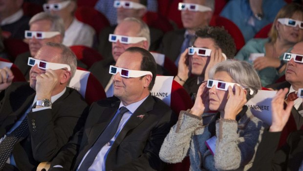 The world watches: French leaders wear 3D glasses to view the landing.