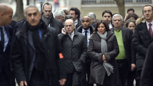Fench Interior Minister Bernard Cazeneuve and Paris Mayor Anne Hidalgo arrive at the scene.