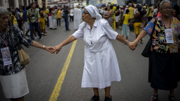 A nun at the procession of Cuba's patron saint, the Virgin of Charity of Cobre, earlier this month. 