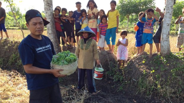 Sceptical: Pak Sudirman has been working on tobacco plantations since he was 10 and says he has no symptoms of tobacco poisoning.