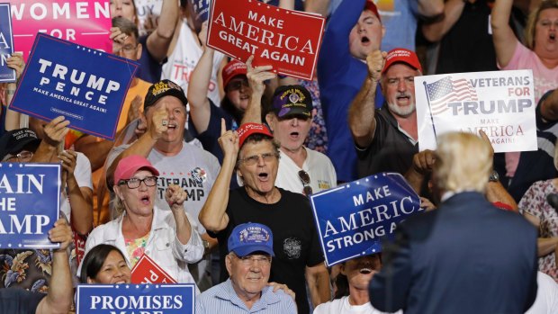 Supporters cheers for US President Donald Trump in Huntington, West Virginia last week. Trump has continued with campaign-style rallies after his election. 