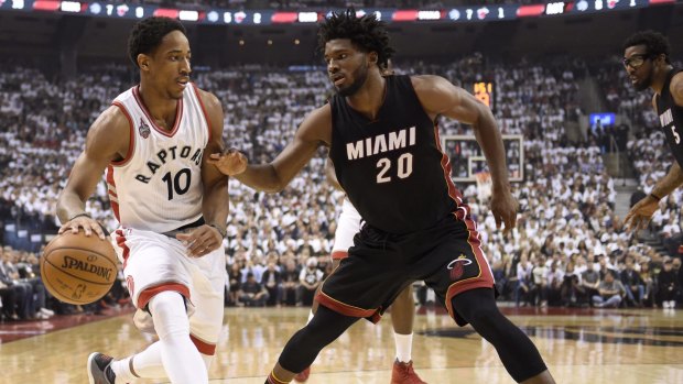 On the drive: Toronto Raptors guard DeMar DeRozan controls the ball as Miami Heat rookie Justise Winslow defends.