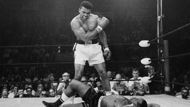 Muhammad Ali stands over fallen challenger Sonny Liston in 1965.