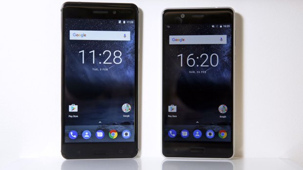 The new Nokia 6 smartphone in matt black, left, and the new Nokia 5 smartphone in silver.