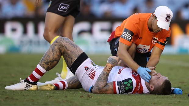 Floored: Josh Dugan lay motionless for 30 seconds after copping an elbow to the face from teammate Russell Packer.