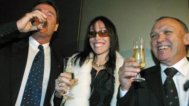 Hollywood Madam HeidI Fleiss (centre) poses with Chairman John Trimble (right) and Chief Executive Officer Andrew Harris of the brothel 'The Daily Planet' at the Australian Stock Exchange.