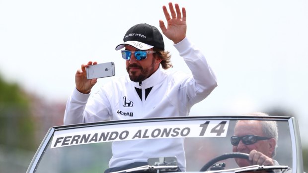 Not happy: Fernando Alonso waves to the fans prior to the Canadian Formula One Grand Prix.