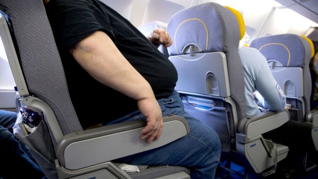 British Airways is being sued by a passenger who claims he was injured after having to sit next to an obese man on a long-haul flight.