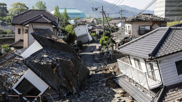 Houses are seen destroyed after a recent earthquake in Kumamoto.
