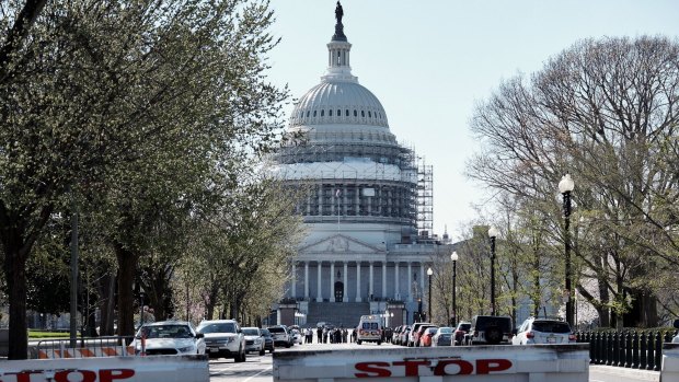 Police lock down the Capitol building after shots were fired.