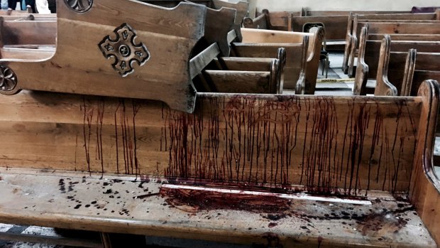 Blood stains pews inside the St. George Church after a suicide bombing, in the Nile Delta town of Tanta, Egypt, 