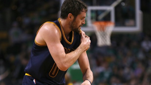 Ouch: Cleveland forward Kevin Love leaves the court after an injury in Boston.