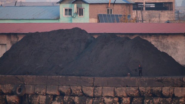 A pile of coal sitting quietly at the port of Sinuiju.