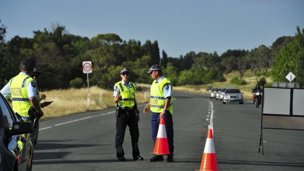 Police secure   the crash site on the Monaro Highway.