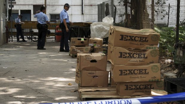 Boxes of beef ribs from the US abandoned by smugglers in Hong Kong as the police close in.