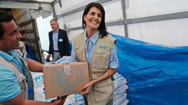 Stronger foreign policy than Trump: US Ambassador to the UN Nikki Haley holds a food parcel part of aid shipments to Syria.