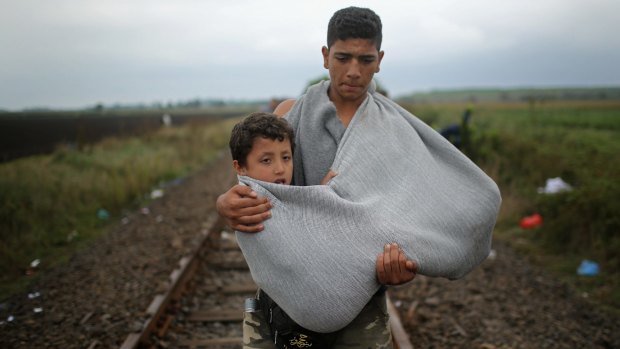A boy in a makeshift sling  in Hungary. 