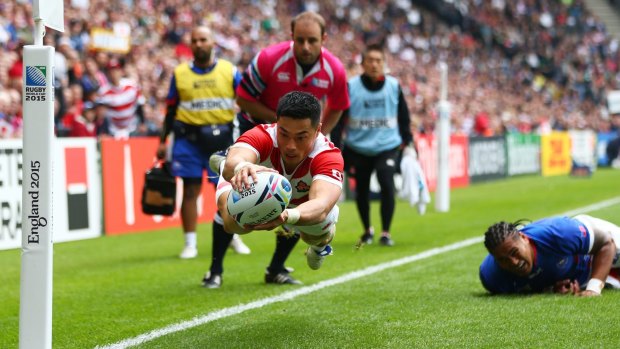 Akihito Yamada scores Japan's second try against Samoa during their Pool B match in Milton Keynes on Saturday.