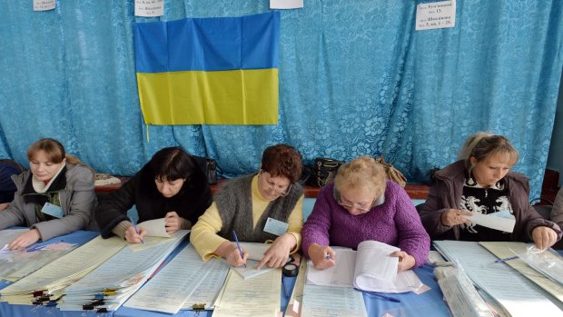 Members of a district electoral commission work in a polling station in the eastern Ukrainian city of Kramatorsk.
