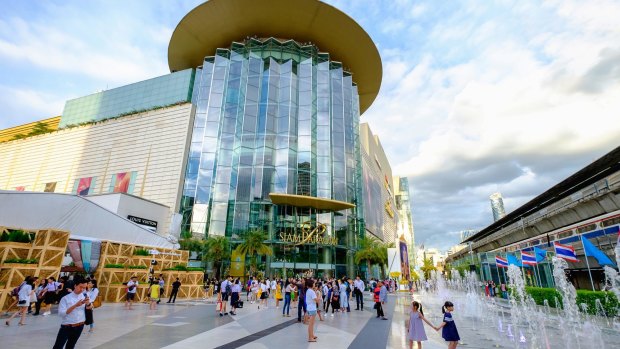 Shoppers visit Siam Paragon mall in Siam Square mall  in Bangkok, Thailand. 