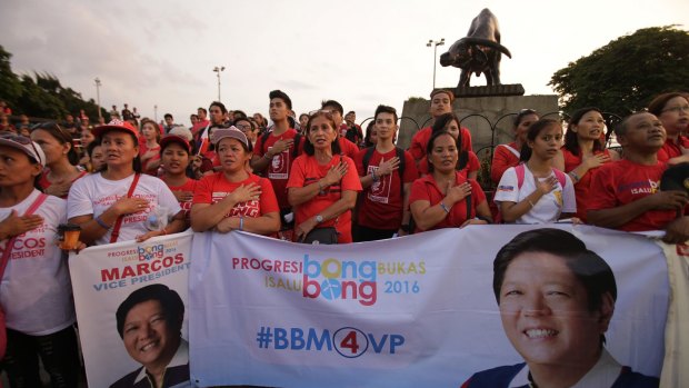 Supporters of vice presidential candidate Senator Marcos  hold a protest in Manila on Wednesday. Election officials challenged Marcos to prove his allegation of irregularities in vote counting.