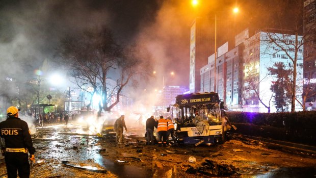 Emergency workers are seen helping victims at the explosion site in Ankara, Turkey.