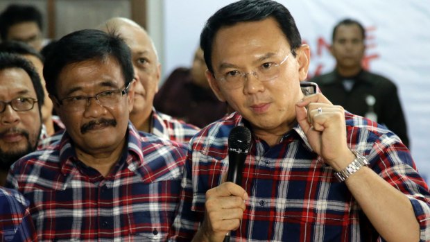 Under pressure: Ahok, right, with his gubernatorial running mate Djarot Saiful Hidayat, a Muslim, in Jakarta last month.  