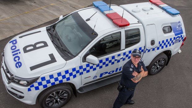 Leading Senior Constable Tim Weiher with one of the new divvy vans that will be on the road from next month. 