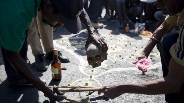 A voodoo ceremony is held prior to a protest against President Michel Martelly's government.