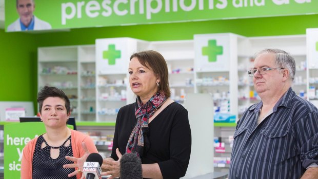 Federal Minister for Health Sussan Ley addresses the media about a new round of medicine price drops which will take effect from October 1. Glen Tilley and Lou Vickers-Willis, pictured, believe they will benefit from the discounts. 