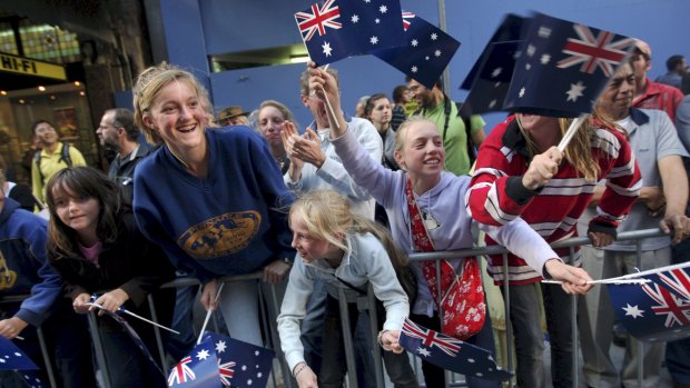 People watch the Anzac Day march as it marches down George Street, Sydney in 2009. 