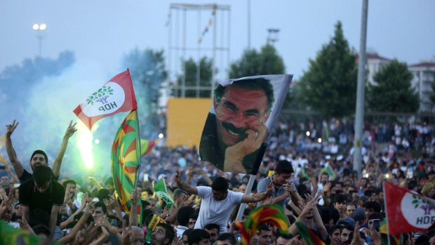 HDP supporters hold aloft a picture of jailed Kurdistan Workers' Party leader Abdullah Ocalan.