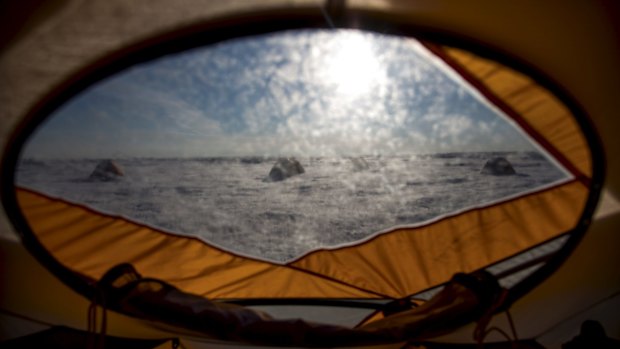 The view from a tent at a researchers' camp near a supraglacial lake and river on the Greenland ice sheet in July. 