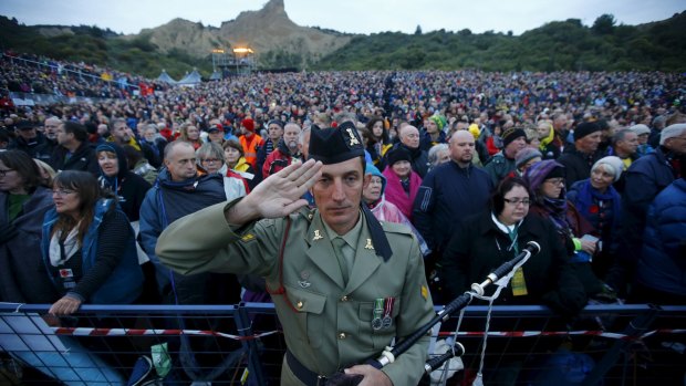 A bagpiper from the Australian army salutes during the dawn ceremony at Anzac Cove on Saturday.