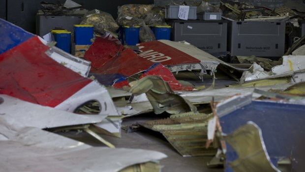The wreckage of flight MH17 in a hangar at Gilze-Rijen airbase, Netherlands. 