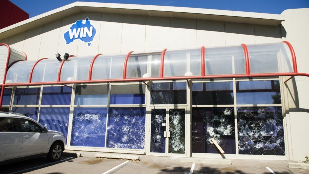 Smashed windows at the WIN TV building on Wentworth Ave, Kingston