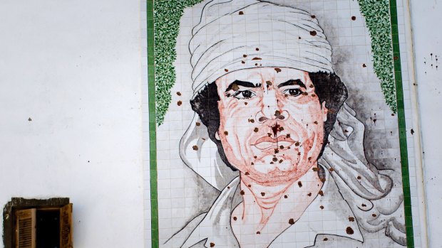 A mural of Libyan dictator Muammar Gaddafi  in Tripoli in 2011.