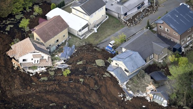 Houses are buried in a landslide caused by an earthquake in Minamiaso, Kumamoto prefecture, on Saturday. 