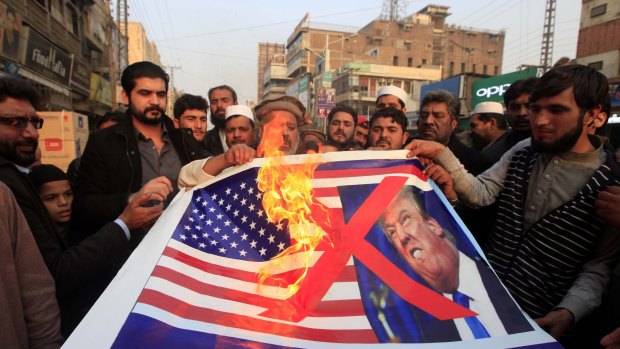 Pakistani traders protest against  Donald Trump in Peshawar, Pakistan, on Friday.