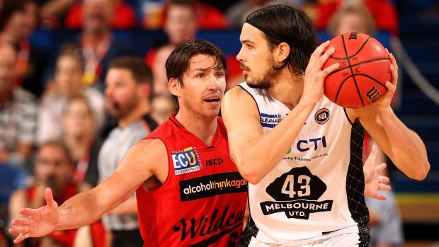 Closely guarded: Damian Martin defends Chris Goulding.