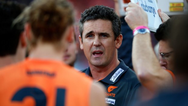 GWS coach Leon Cameron with his players during a break.