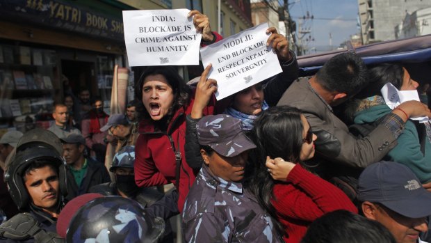 Nepalese activists protest against India's role in the blockade outside Delhi's embassy in Kathmandu.