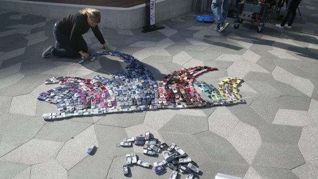 At UTS, 460 old mobile phones have been assembled into the shape of the Sydney Opera House to raise awareness about recycling handsets.