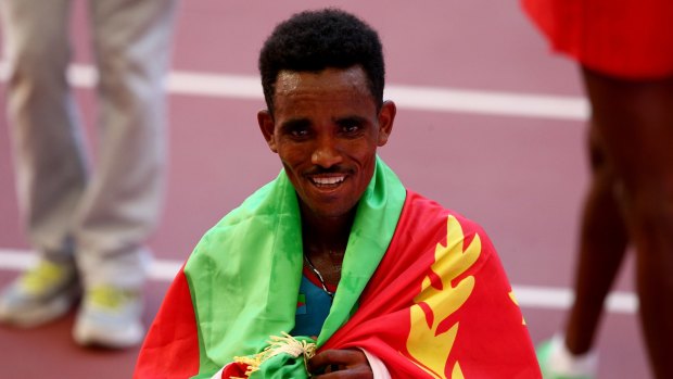 Ghirmay Ghebreslassie of Eritrea celebrates after crossing the line to win gold in the Men's Marathon in the World Athletics Championships in Beijing in August. Sport has been a path that many elite Eritrean athletes have used to seek asylum outside their country. 
