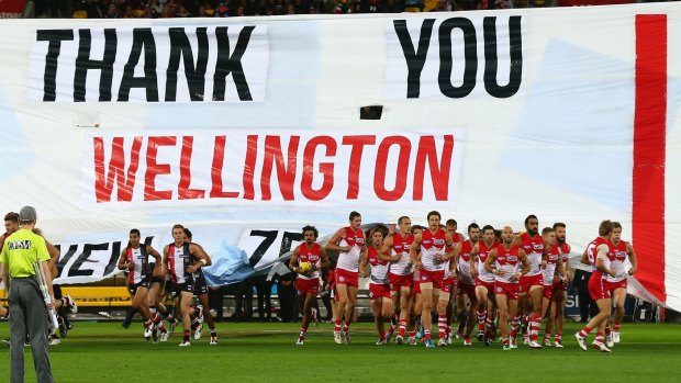 St Kilda and Sydney burst through their shared banner ahead of the first AFL game in Wellington two years ago.