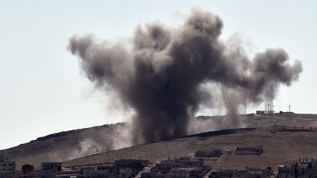 Targeting Islamic State positions: Smoke rises following an air strike on the eastern sector of the Syrian town of Kobane.